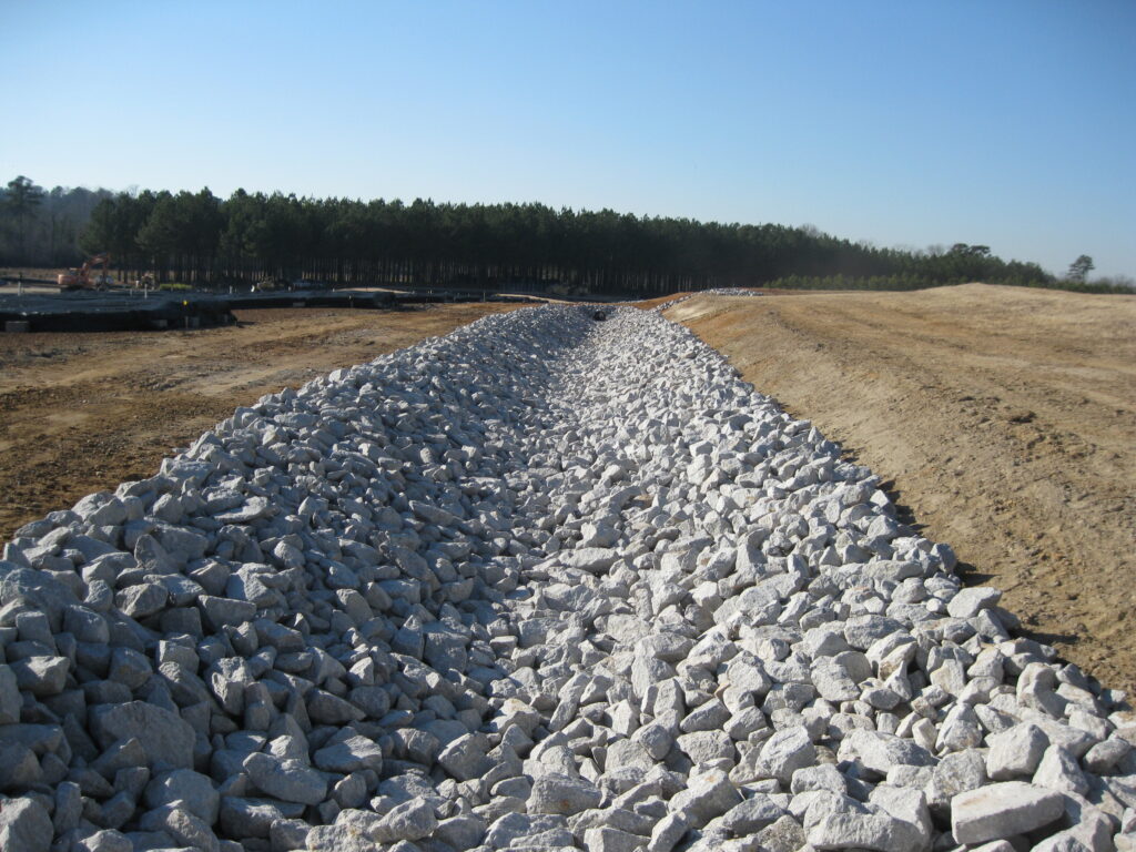 Rock drainage line along a field.